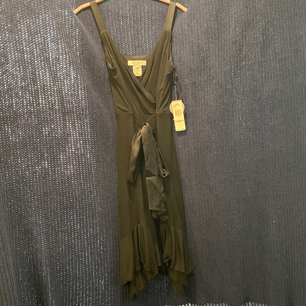 Black sleeveless knee length cocktail dress.